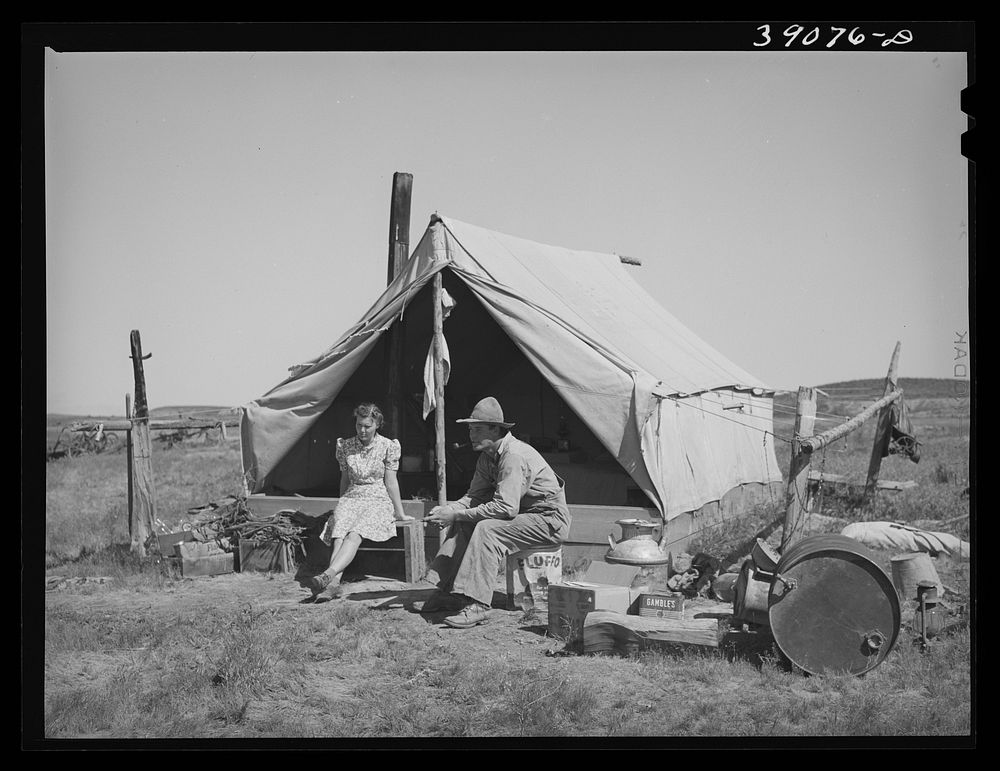 Farmer and his wife in front of their tent home. Vale-Owyhee rrigation project, Malheur County, Oregon. This is their first…