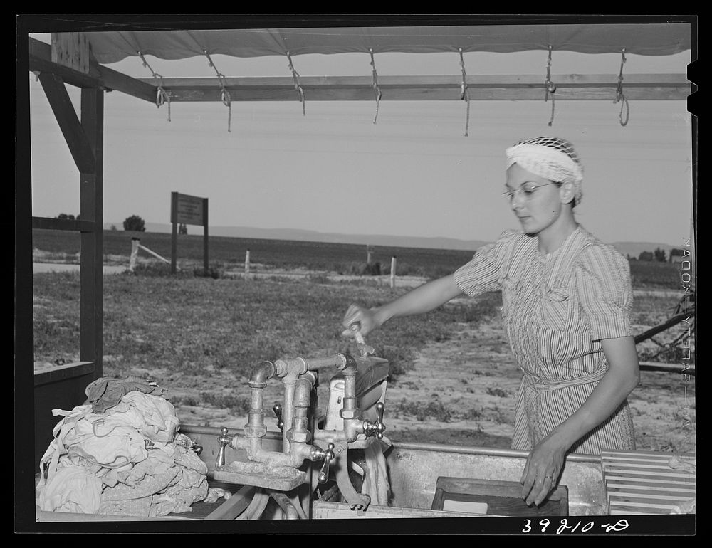 The nurse does her laundry at the FSA (Farm Security Administration) migratory labor camp mobile unit. Wilder, Idaho by…
