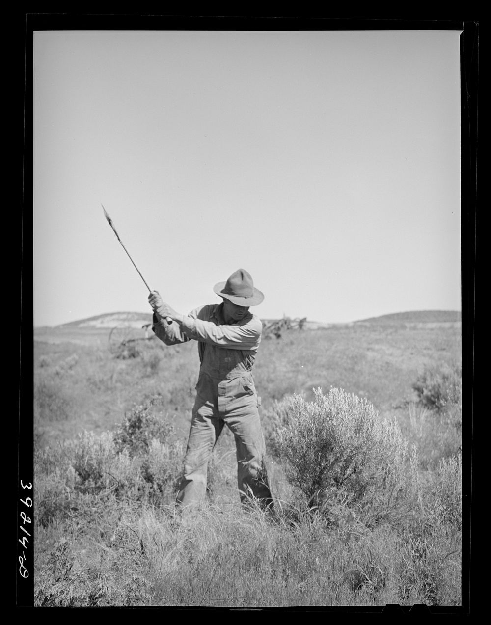 Newly-arrived farmer clearing land of sage brush. Vale-Owyhee irrigation project, Malheur County, Oregon. On the Vale-Owyhee…