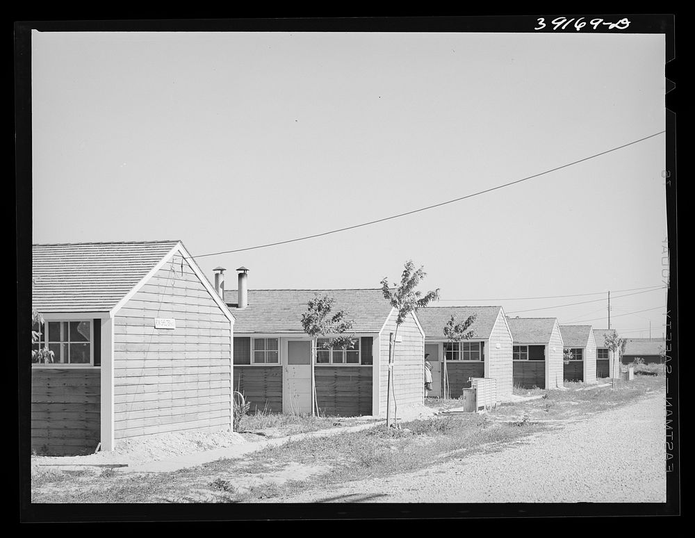 [Untitled photo, possibly related to: Row shelters at the FSA (Farm Security Administration) farm workers' camp. Caldwell…