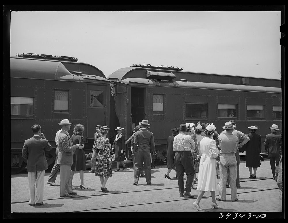 These four photographs were taken at the railroad station when a noon train came in. All trains coming into San Diego are…