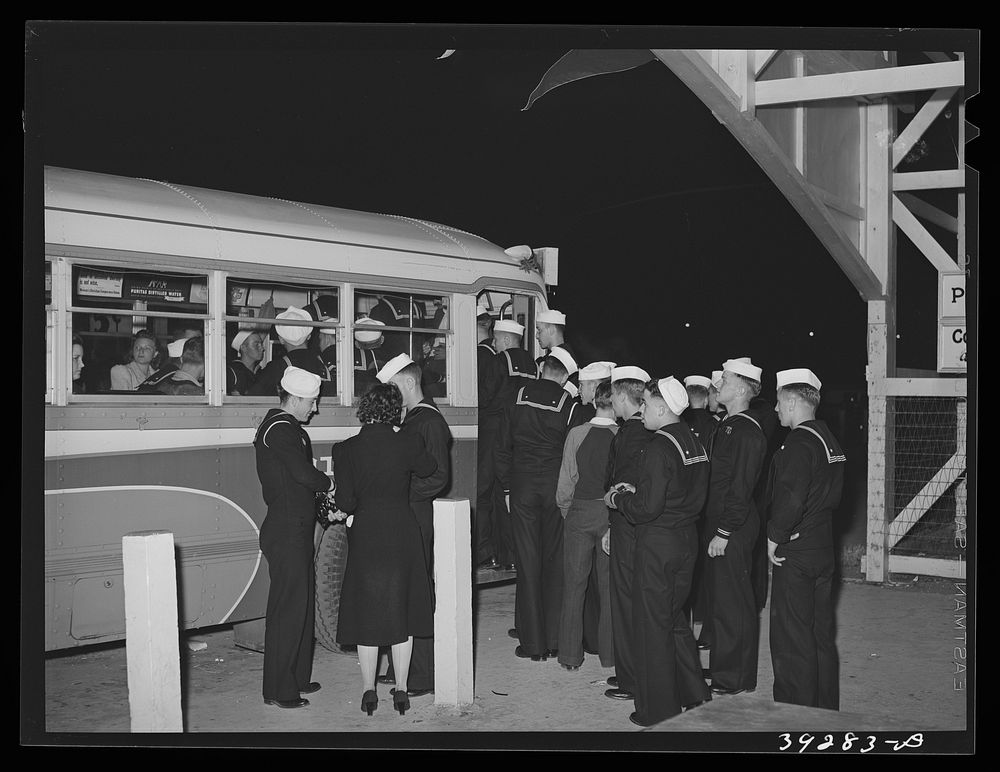 Sailors boarding a bus at Mission Beach, amusement center. San Diego, California by Russell Lee