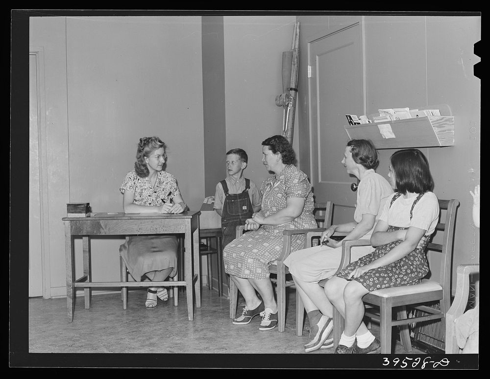 Waiting to see the doctor at the clinic of the FSA (Farm Security Administration) labor camp. Caldwell, Idaho by Russell Lee