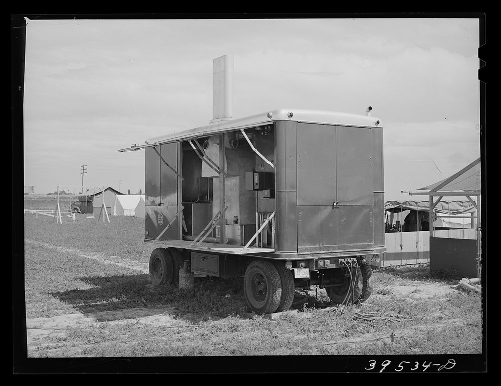 Diesel unit for power at the mobile unit of the FSA (Farm Security Administration) labor camp. Caldwell, Idaho by Russell Lee