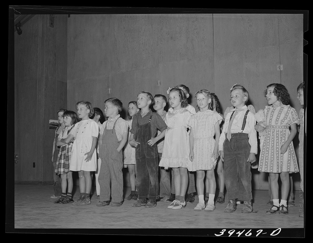 Schoolchildren in program at end of school term. FSA (Farm Security Administration) labor camp. Caldwell, Idaho by Russell…