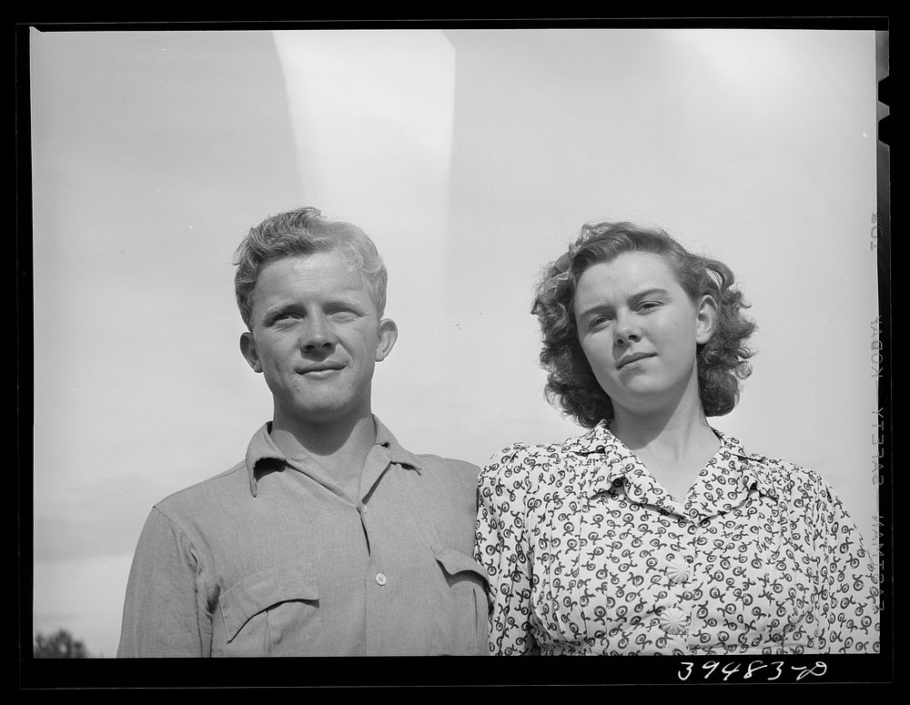 [Untitled photo, possibly related to: This boy and girl were the champion pea pickers in the contractor's camp. They travel…