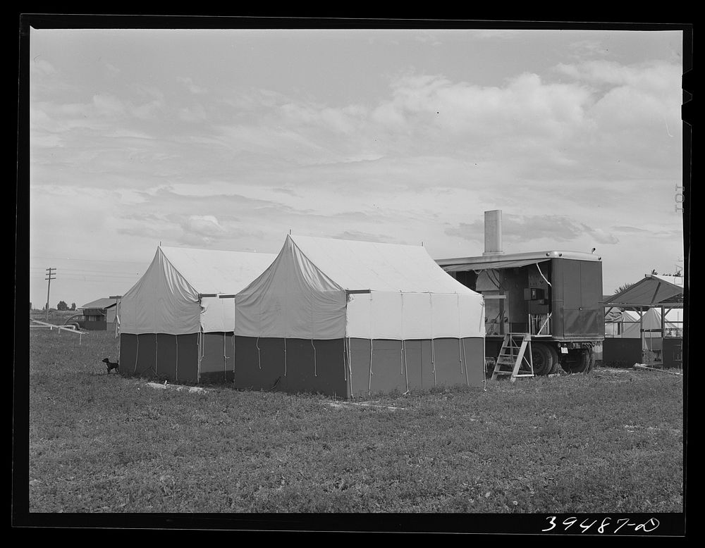 Nampa, Idaho. Mobile unit of the FSA (Farm Security Administration) camp for migratory farm workers. Tents of staff members…