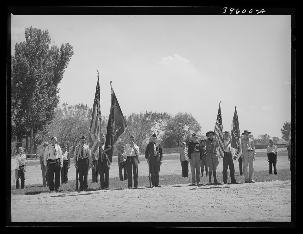 Members of the American Legion and Boy Scouts stand at attention while Chief Justice Stone delivered the oath of allegiance…