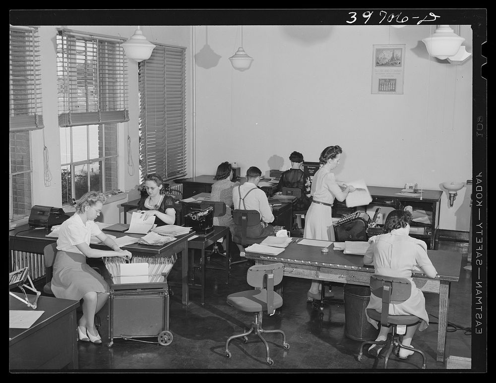 Office workers at the Dairymen's Cooperative Creamery. Caldwell, Canyon County, Idaho by Russell Lee