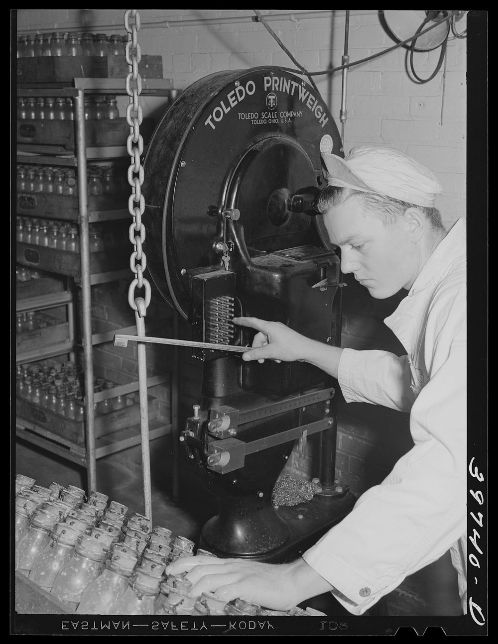 [Untitled photo, possibly related to: Recording weight, etc. of samples of cream and milk at Dairymen's Cooperative…