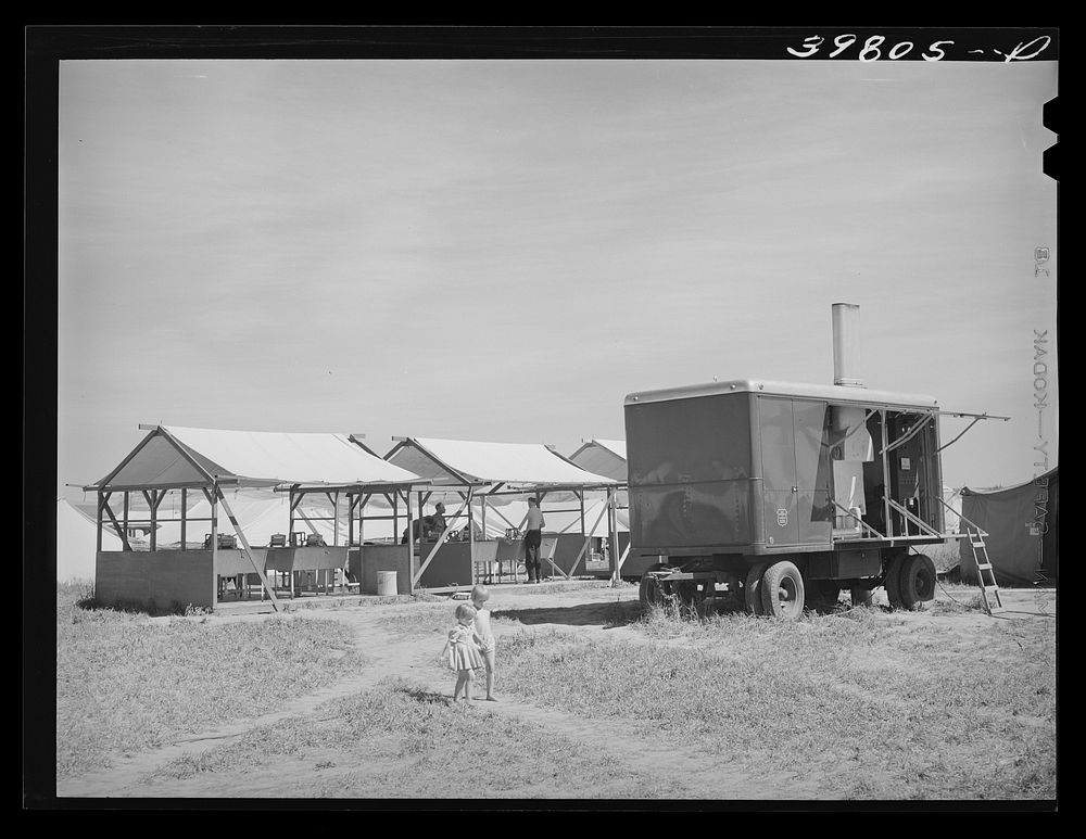 Power unit and laundry shelters at the FSA (Farm Security Administration) migratory farm labor camp mobile unit. Athena…