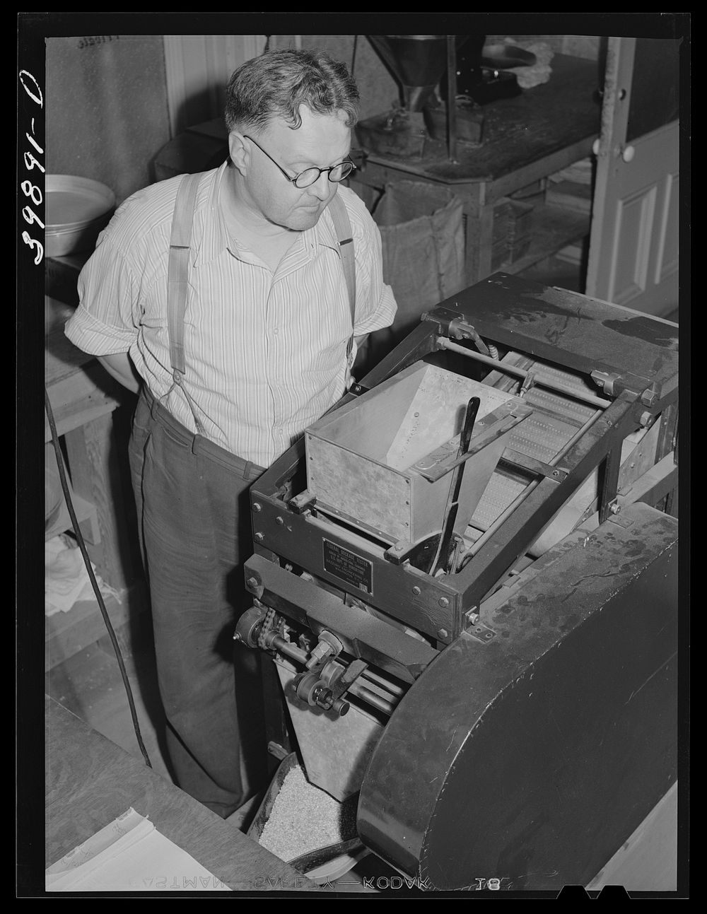 [Untitled photo, possibly related to: State inspector running dockage test on wheat. Walla Walla County, Washington] by…