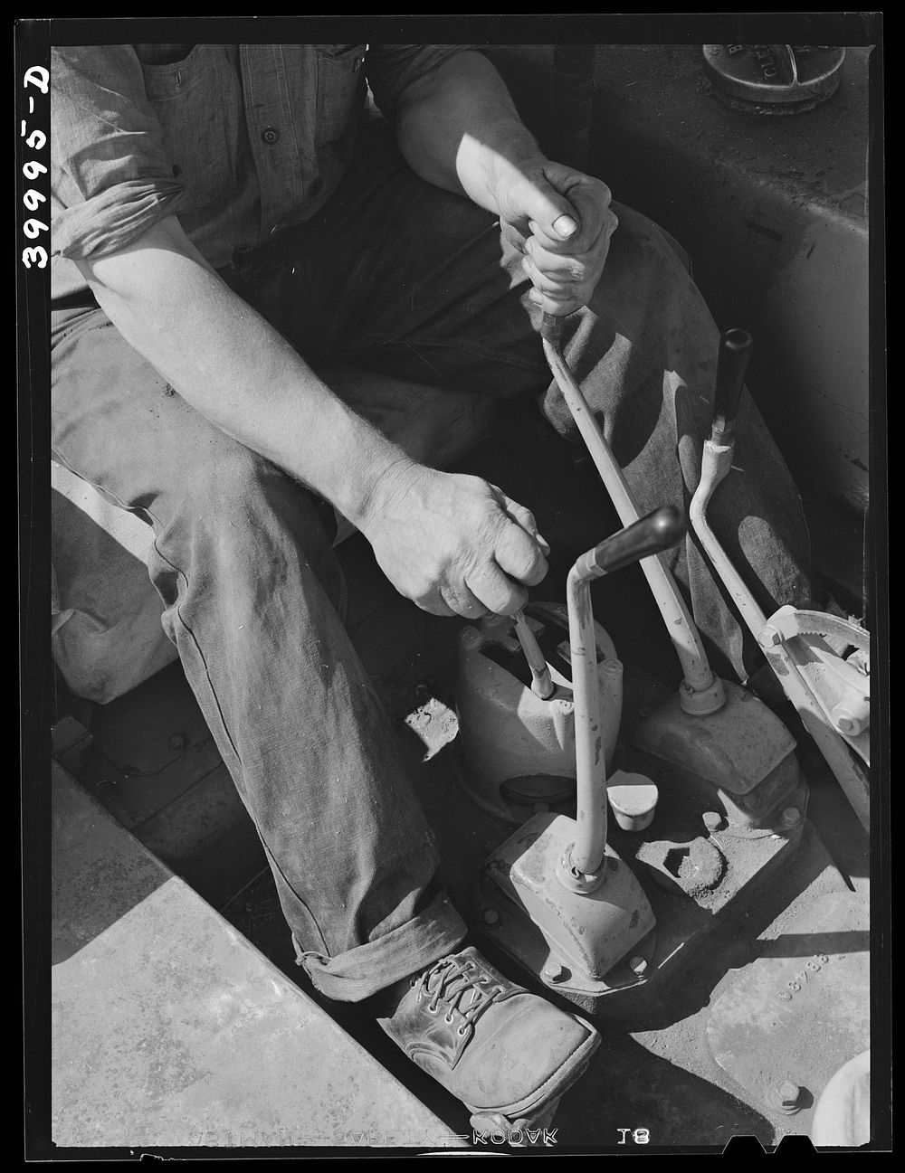 [Untitled photo, possibly related to: Gear levers on caterpillar tractor. Whitman County, Washington] by Russell Lee