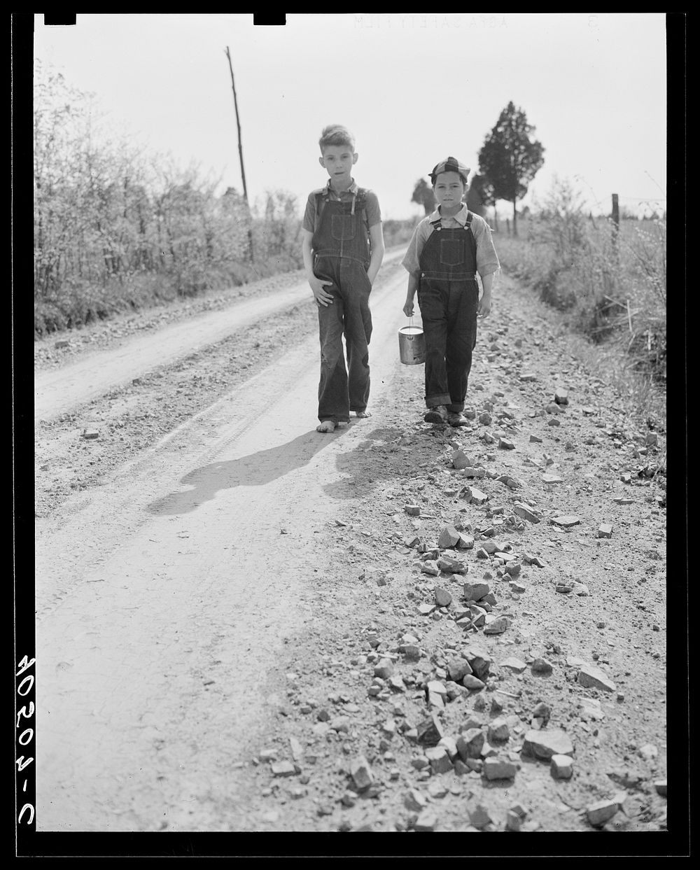 Boys on way home from school. Near Sterling, Virgina. Sourced from the Library of Congress.