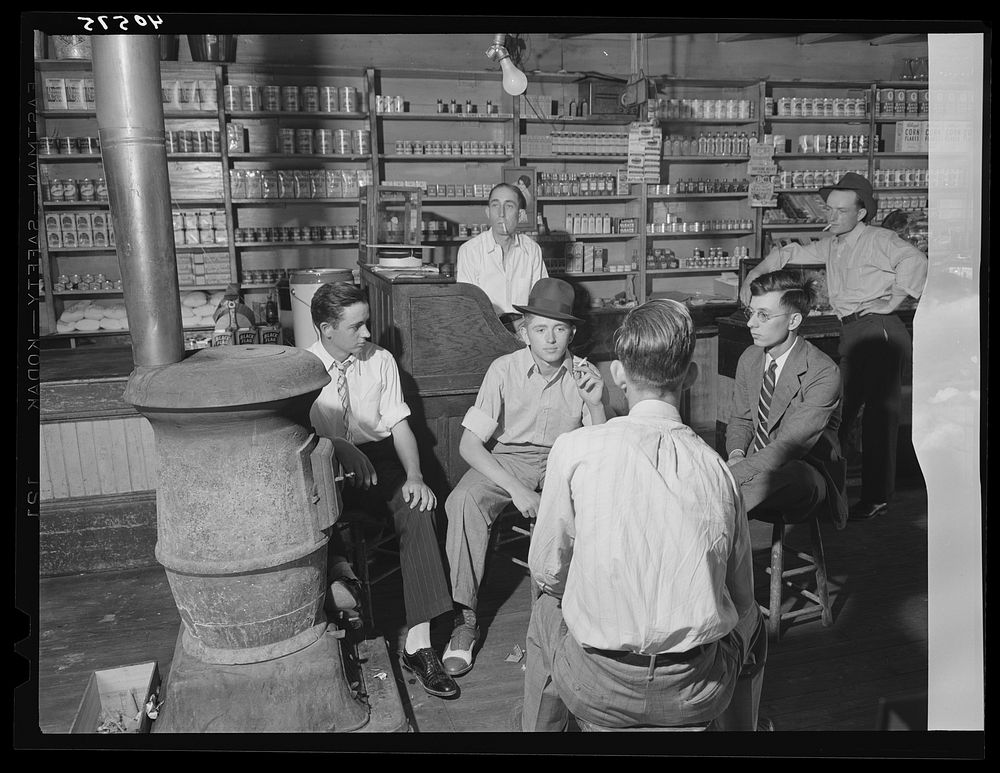 Interior of general store at Stem, Granville County, North Carolina, with high school boys dressed up because it's Election…