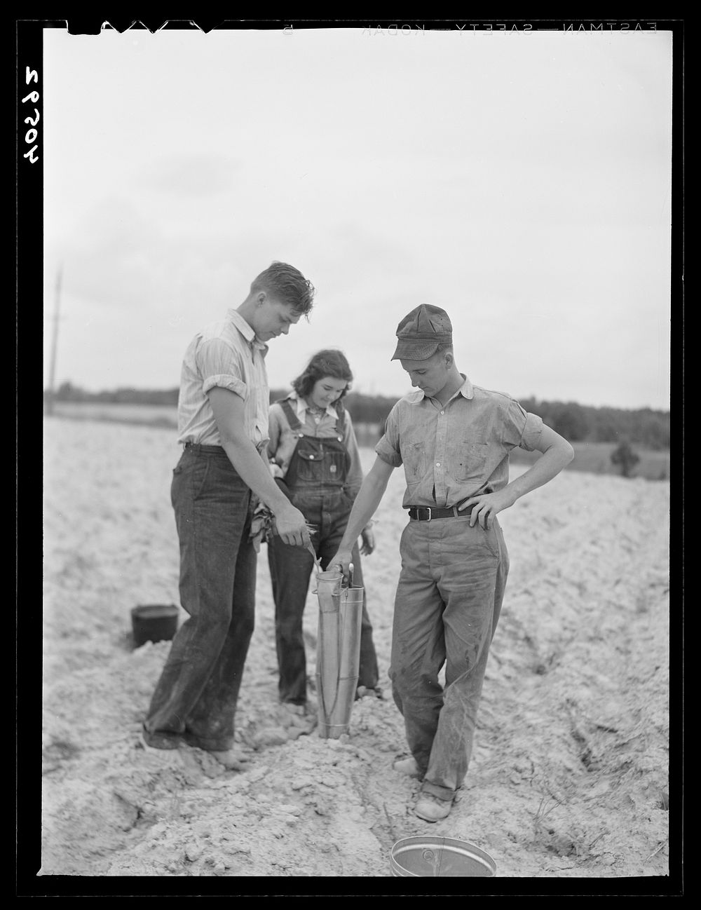 [Untitled photo, possibly related to: Tenant farmer and part of his family in field ready for tobacco planting. Nine miles…