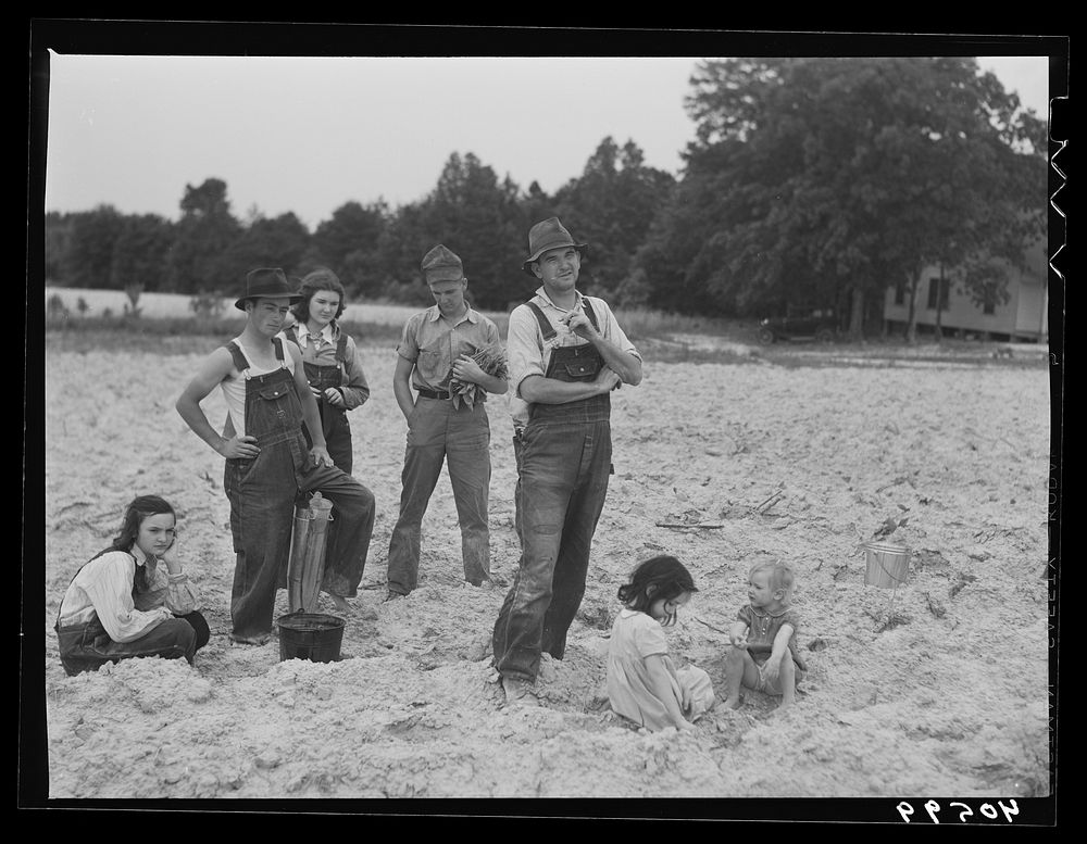 [Untitled photo, possibly related to: Tenant farmer and part of his family in field ready for tobacco planting. Nine miles…