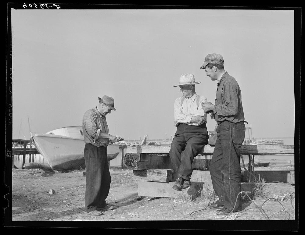 [Untitled photo, possibly related to: Deal Island fisherman. Man on left is opening an oyster. Eastern Shore, Maryland].…
