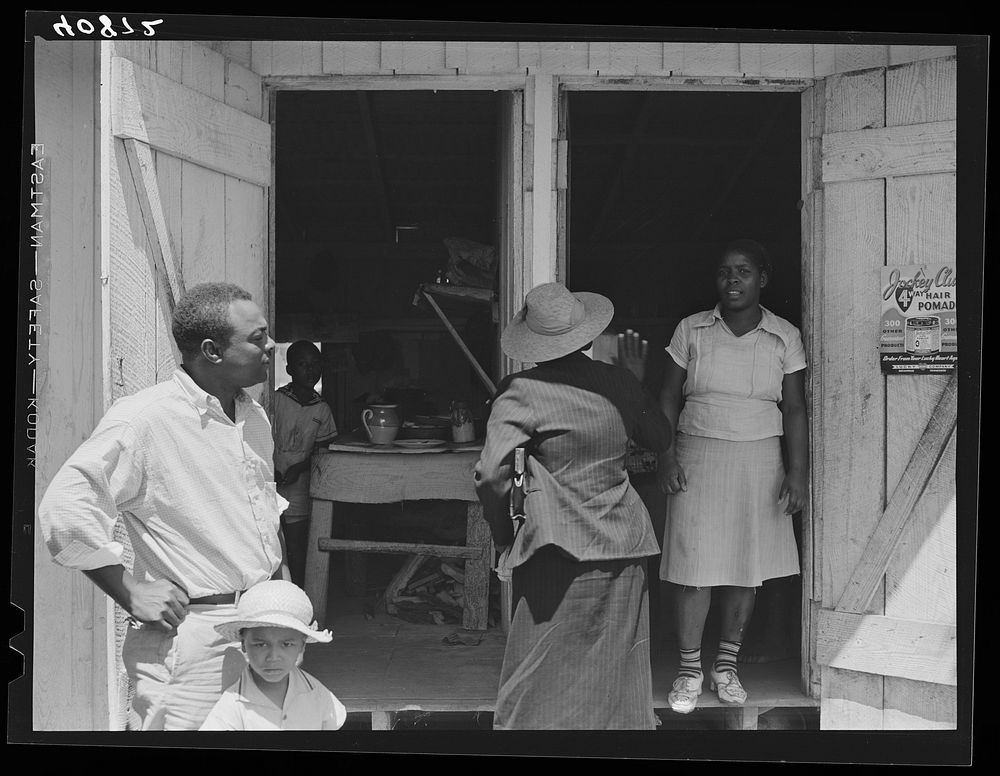 Group of migratory workers in the camp of the Phillips Packing Company at Vienna, Maryland. Sourced from the Library of…