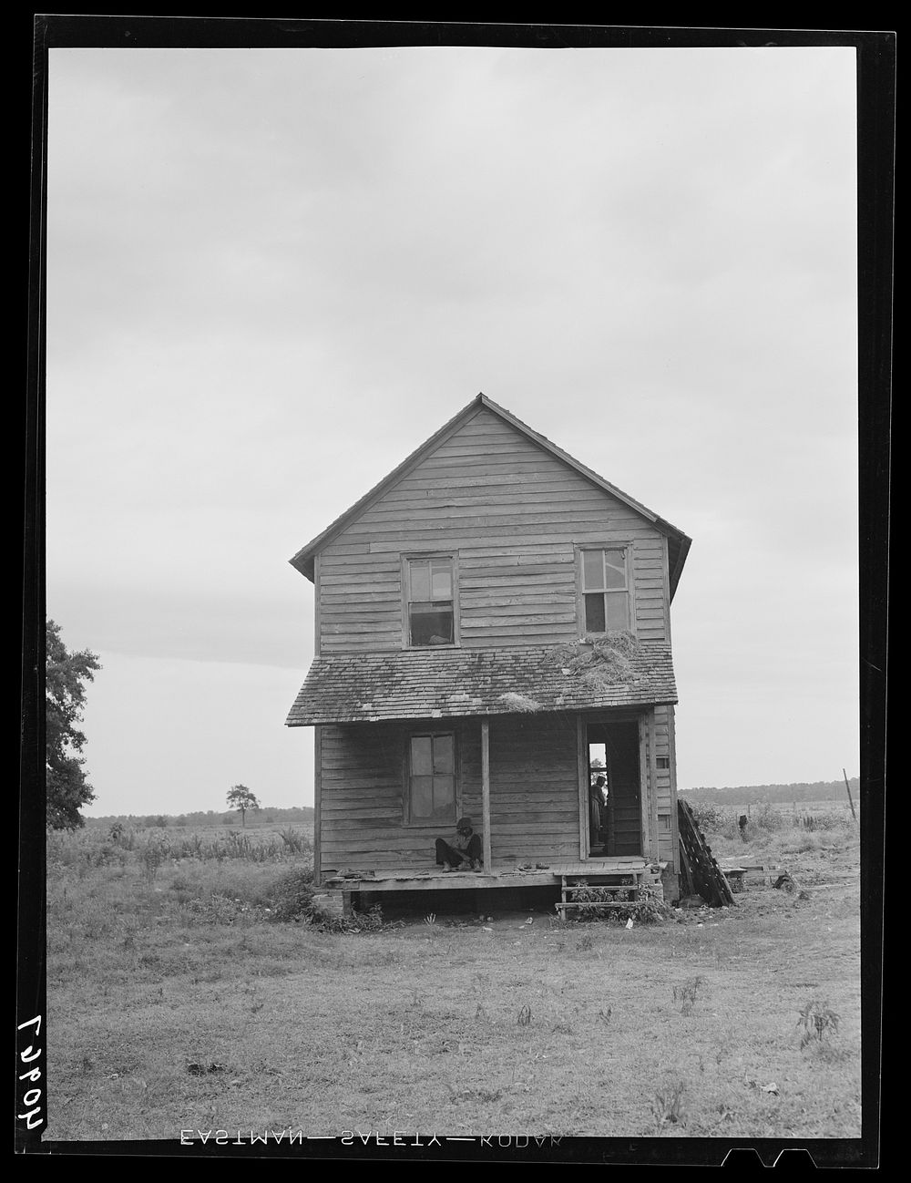 [Untitled photo, possibly related to: Florida migrant making preparations to leave a house at Belcross, North Carolina, for…