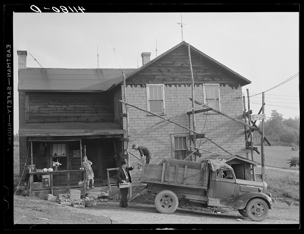 Loading produce to be taken to Tri-County Farmers Co-op Market in Du Bois, Pennsylvania, at the Knees farm near Penfield…