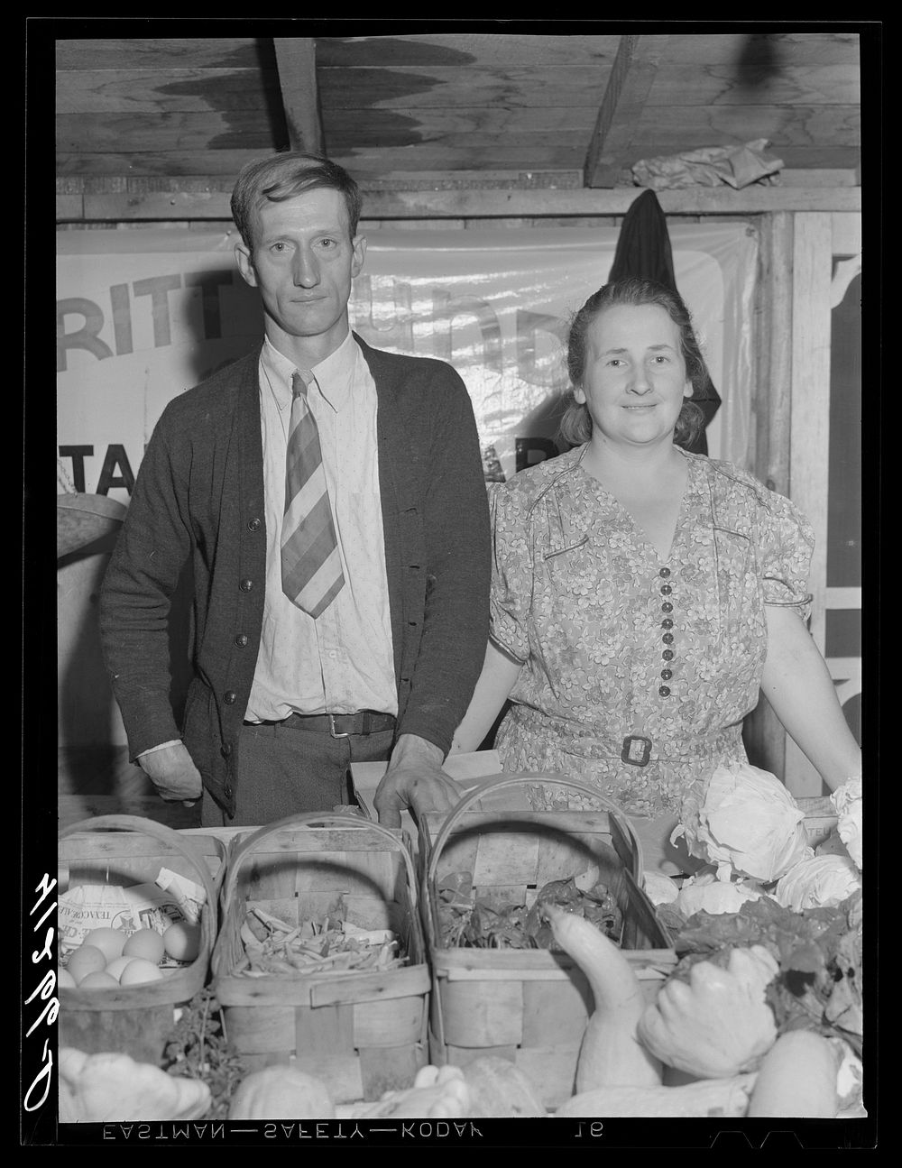 [Untitled photo, possibly related to: Mr. and Mrs. Bundy at their booth at the Tri-County Farmers Co-op Market at Du Bois…
