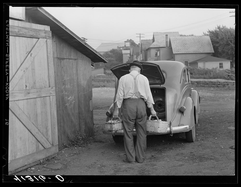 Mr. Ralph Reitz unloading produce outside of Tri-County Farmers Market in Du Bois, Pennsylvania. Produce to be sold at…