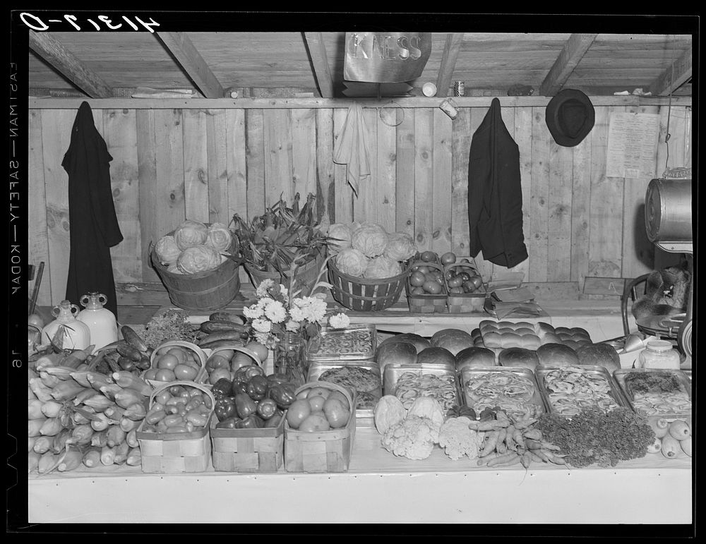 The booth of Mr. Kness at the Tri-County Farmers Co-op Market in Du Bois, Pennsylvania. Sourced from the Library of Congress.
