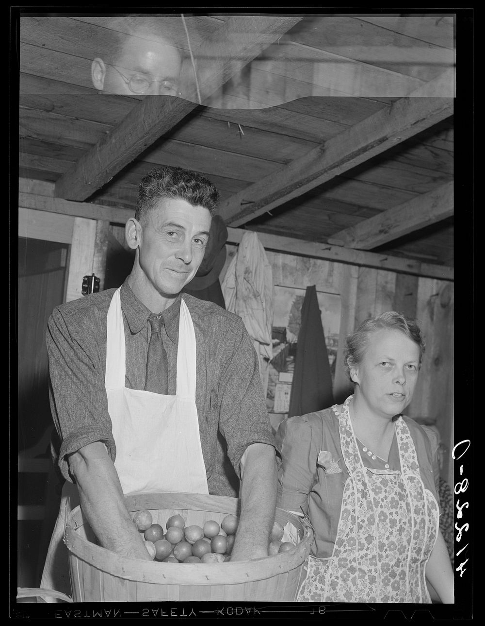 [Untitled photo, possibly related to: Mr. Cooper, member of board of directors of the Tri-County Farmers Co-op Market at Du…