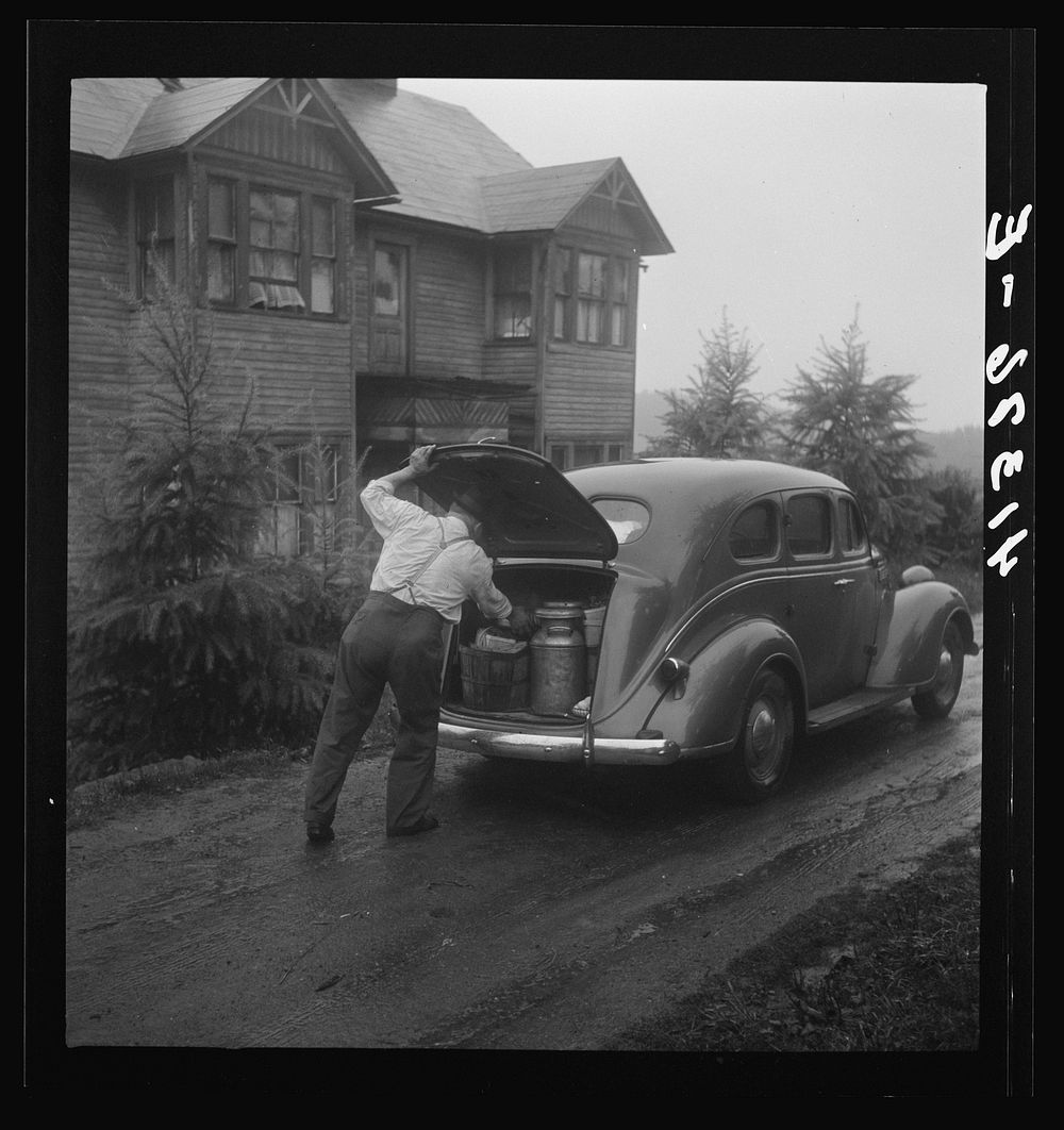 Mr. Ralph Reitz loading produce at his farm near Falls Creek, Pennsylvania for sale at the Tri-County Farmers Co-op Market…