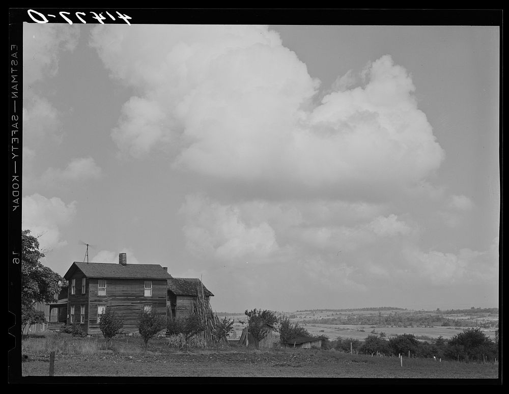[Untitled photo, possibly related to: Farmhouse and windmill in Sugar Hill country, submarginal area near Townsend, New…