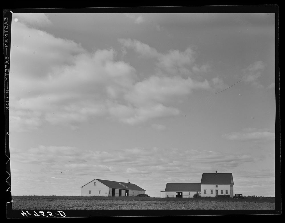 Tractor garage and house occupied by the cook on one of the farms of the Woodman Potato Company eleven miles north of…