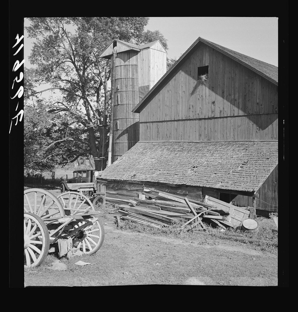 Old boards and rusty nails piled up where they might be dangerous. Farm of Mr. Theodore German. North Branford, Connecticut…