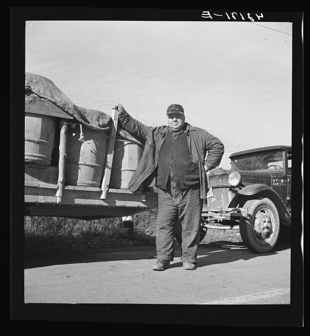 French-Canadian potato farmer waiting with a truckload of potatoes at a starch factory in Caribou, Maine for his potatoes to…