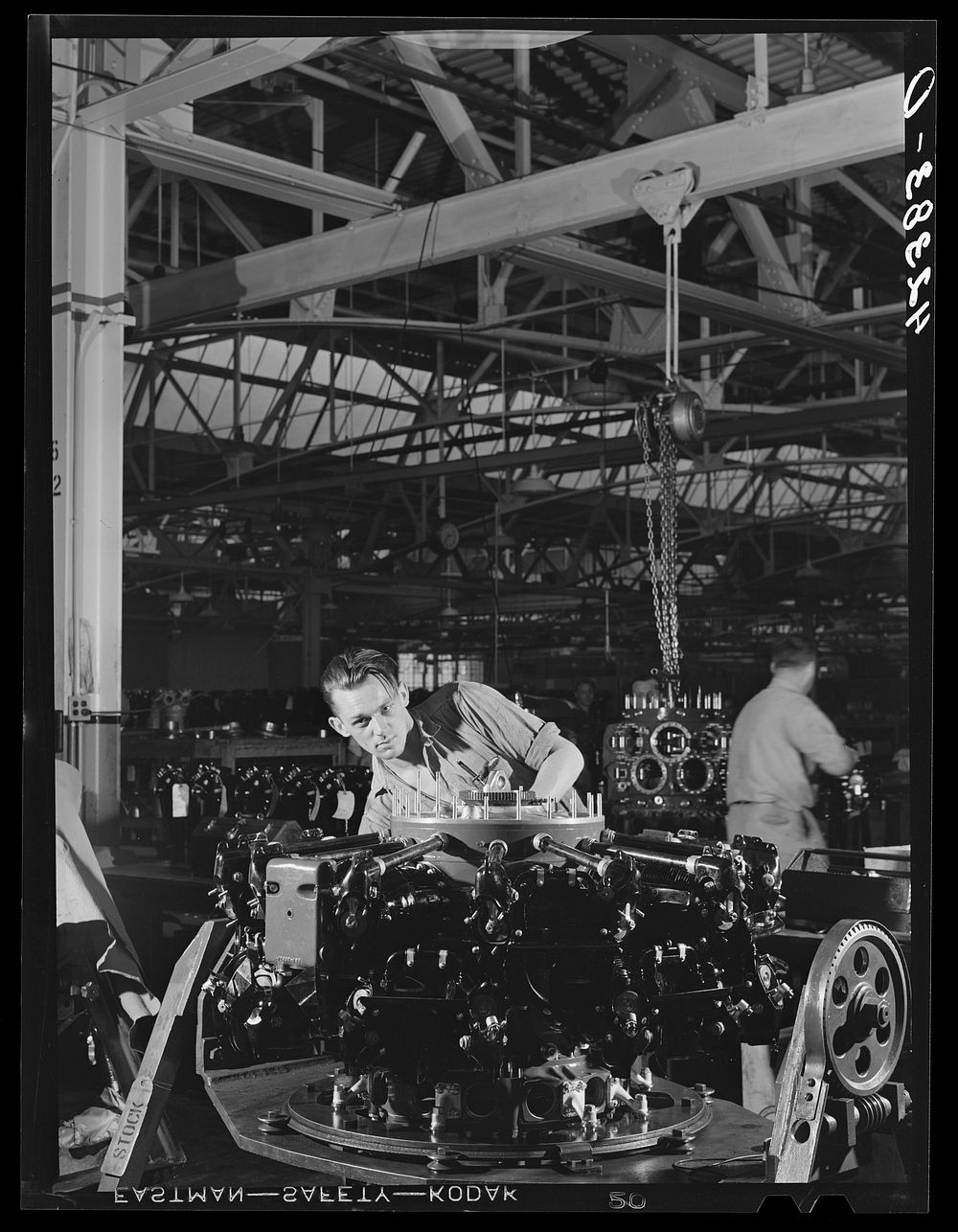 Winging on the final stages of a Pratt and Whitney Aircraft motor at East Hartford, Connecticut. Sourced from the Library of…