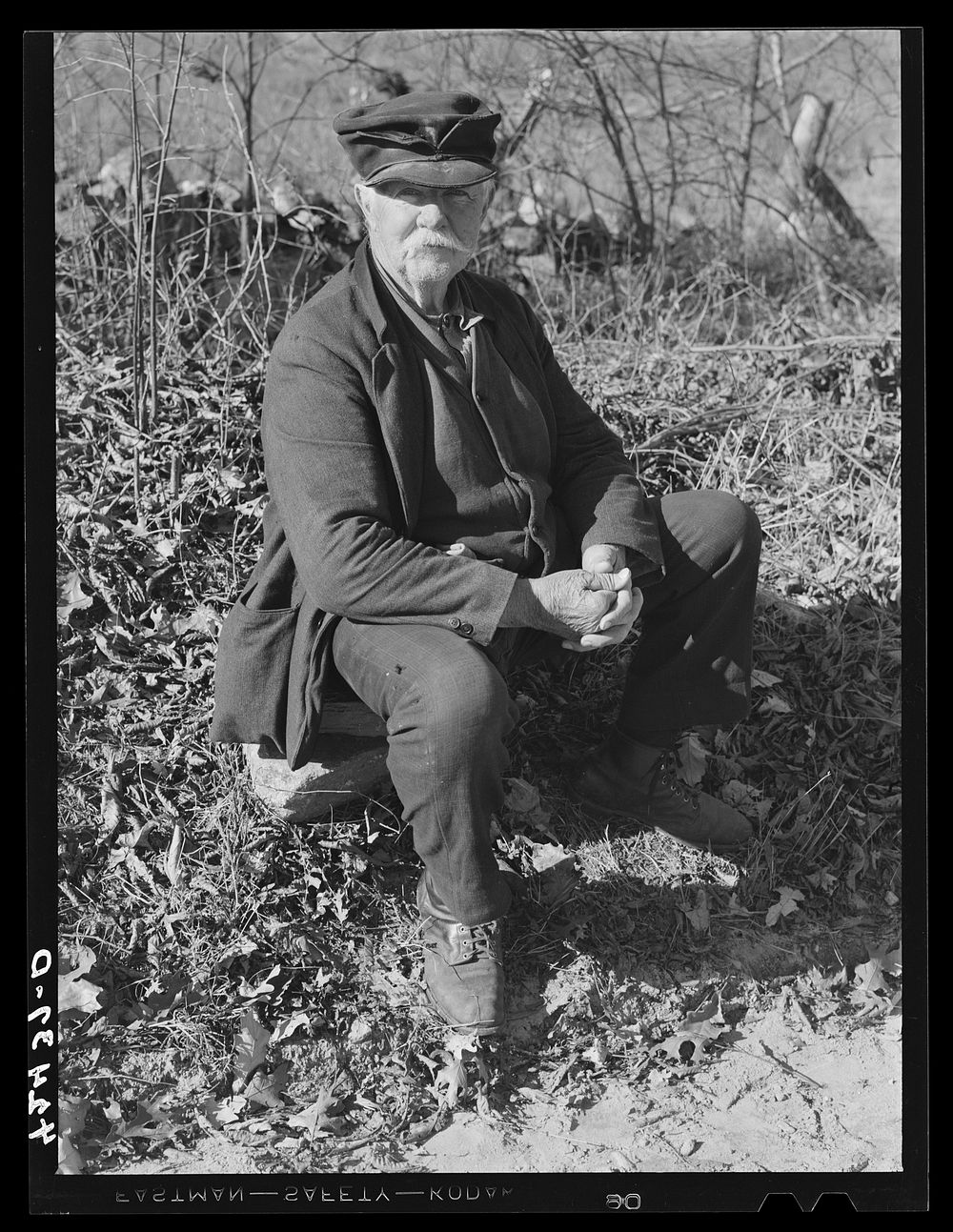 Jim Grey, retired old farmer of Ledyard, Connecticut, waiting for the noon mail at the crossroads. Sourced from the Library…
