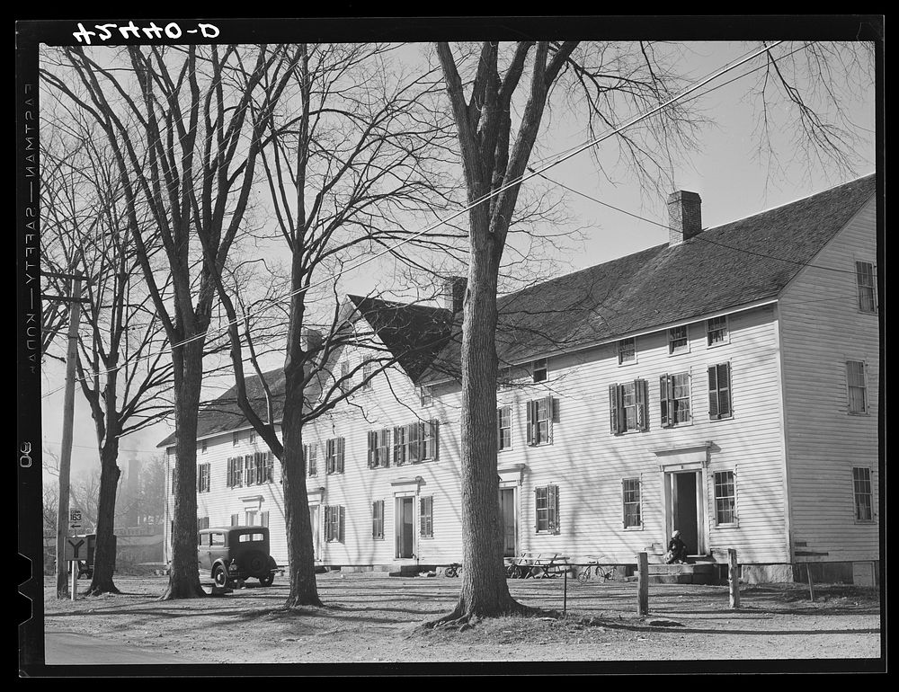 [Untitled photo, possibly related to: Old company house in Fitchville, Connecticut. The Palmer Brothers mill in town is busy…