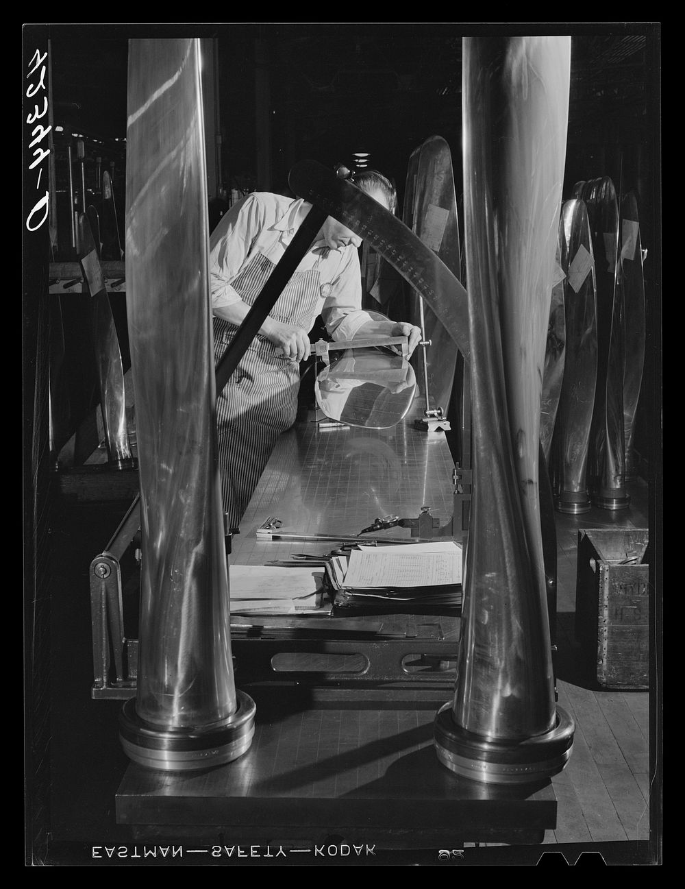 A propeller at the inspection table undergoing tests for pitch and curvature. Hamilton Standard Propeller Corporation. East…
