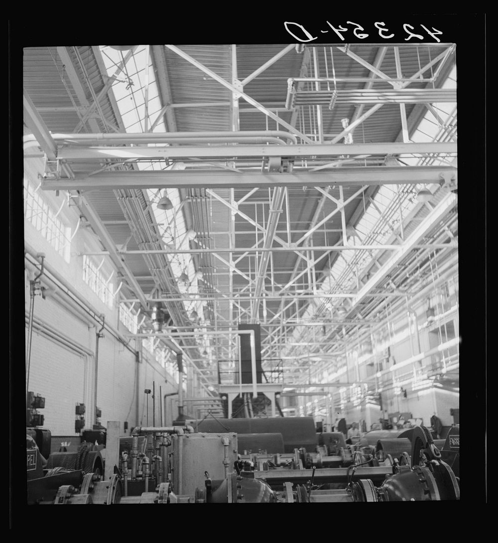 General view on one of the factory floors at the Pratt and Whitney Aircraft Corporation. East Hartford, Connecticut. Sourced…