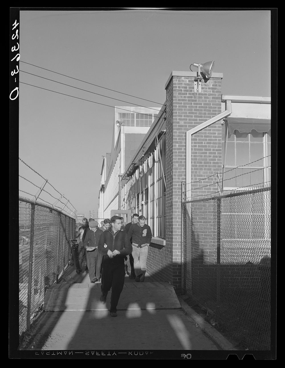 Workmen leaving the plant at Vought Sikorsky Aircraft Corporation. Stratford, Connecticut. Sourced from the Library of…