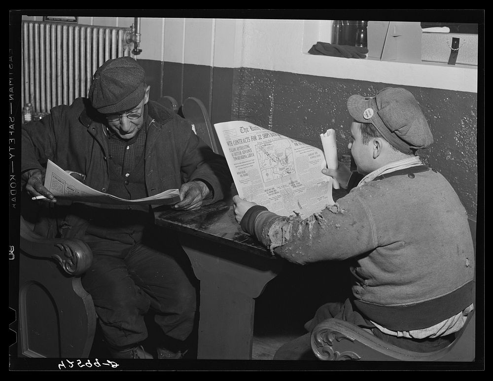 Shipyard workers reading Bath paper in a bar near shipyard. Bath, Maine. Sourced from the Library of Congress.