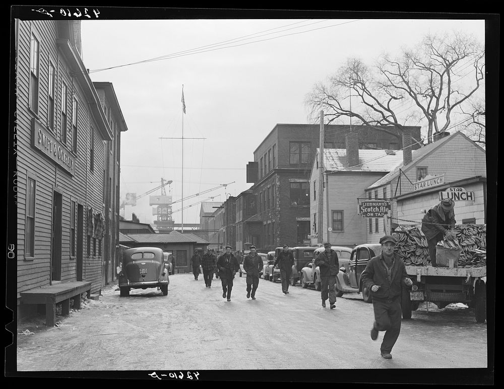 Men coming out of the shipyard at noon hour for lunch. Bath, Maine. Sourced from the Library of Congress.