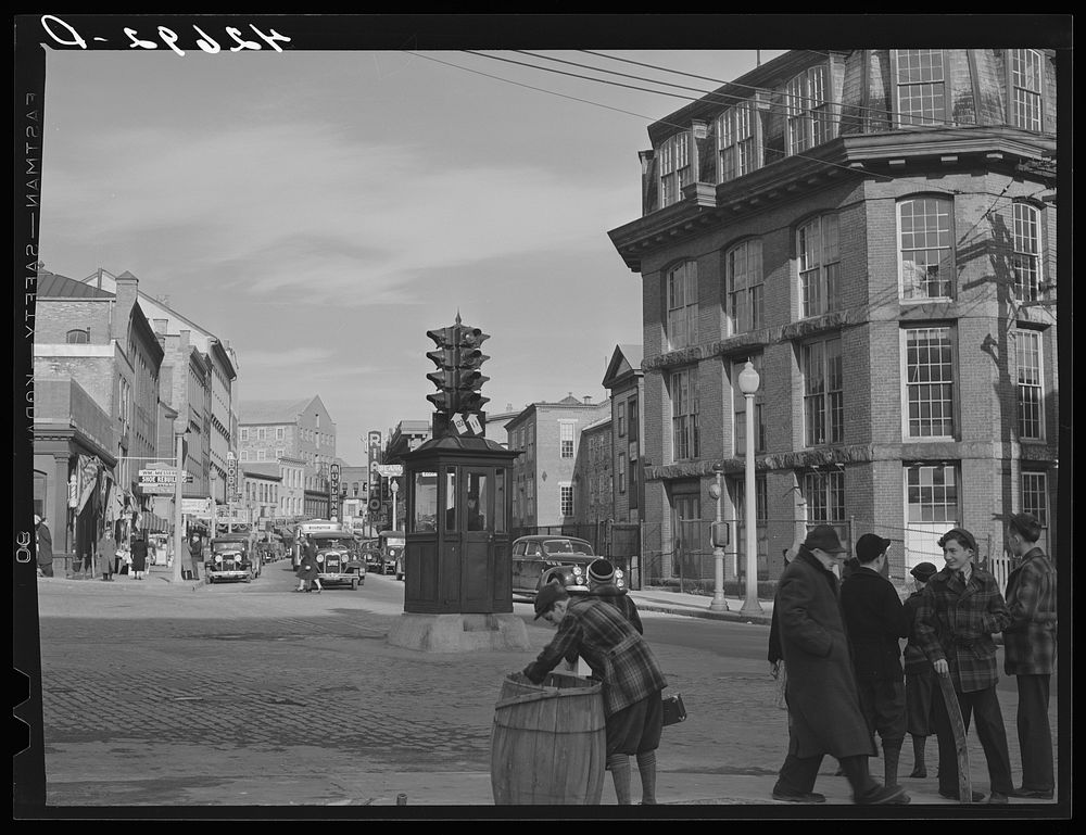 Street leading into the main business center of Woonsocket, Rhode Island. Sourced from the Library of Congress.