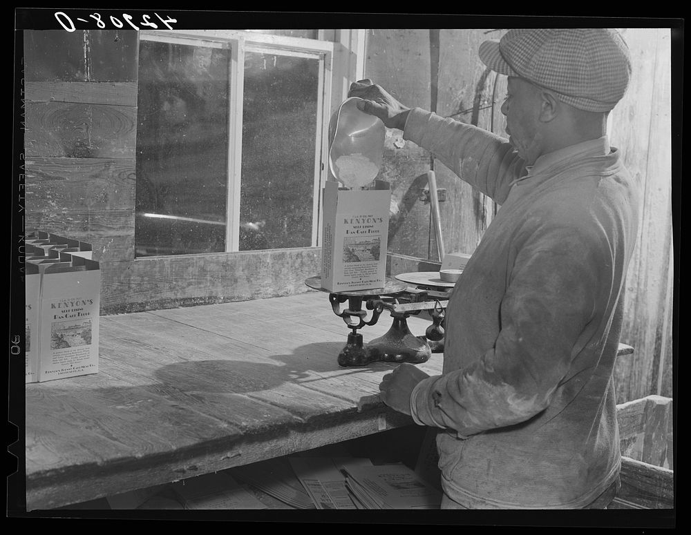Filling pound boxes of Kenyon's pancake flour at the old mill in Usquepaugh, Rhode Island. Sourced from the Library of…