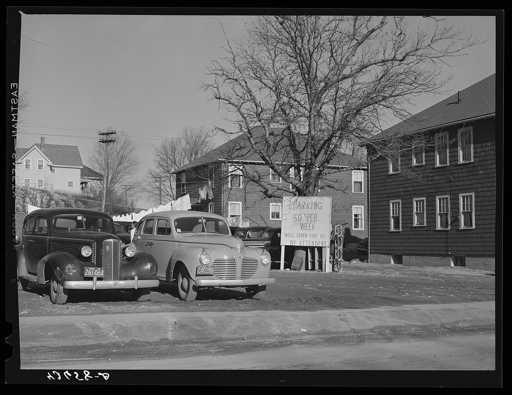 Sign advertising parking space in backlot of a private house in the vicinity of the shipyards in Quincy, Massachusetts.…