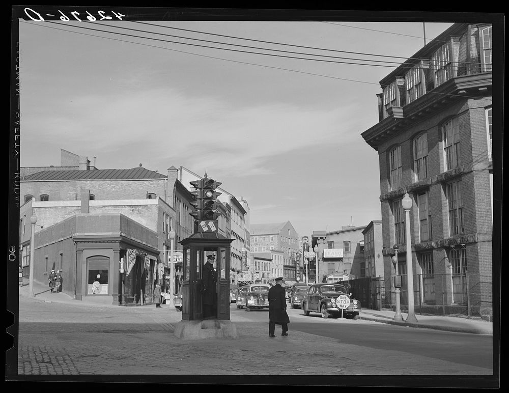 General view entering the business section of Woonsocket, Rhode Island. Sourced from the Library of Congress.