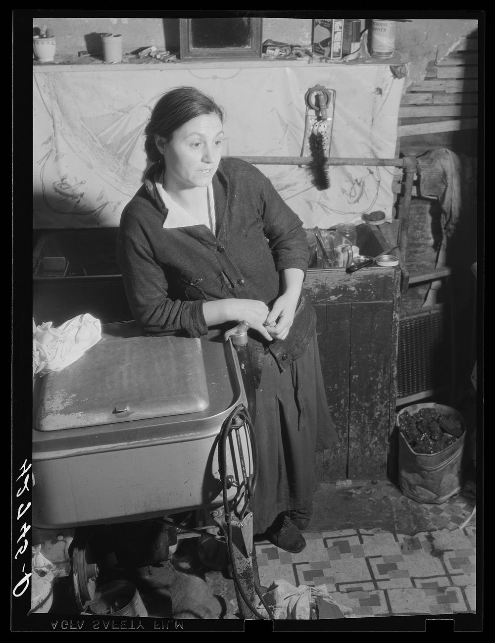 Mrs. M. Vieta, Portuguese wife of a FSA (Farm Security Administration) client. At present she is looking after the farm and…