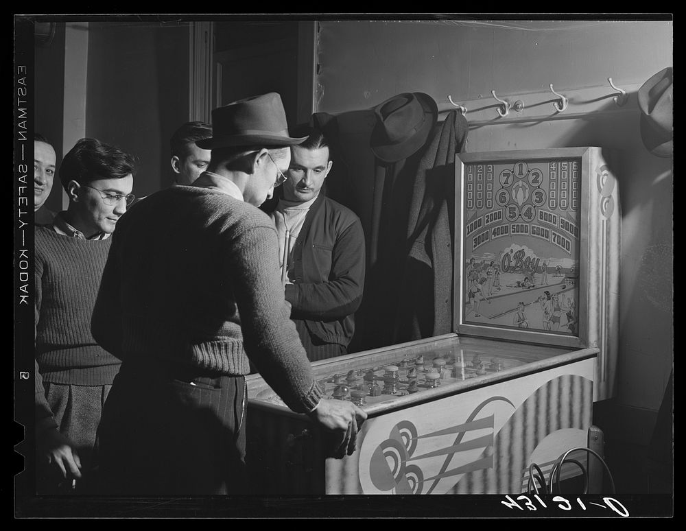 Playing the pinball machine at the steelworkers' Serbian Club in Aliquippa, Pennsylvania. Sourced from the Library of…
