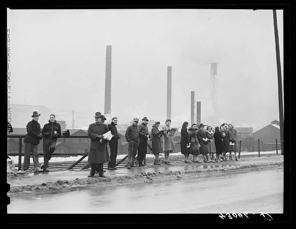[Untitled photo, possibly related to: Steelworkers going home at the end of the afternoon shift. A union official is…