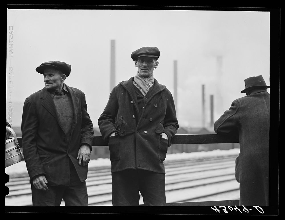 Steelworkers of the Jones and Laughlin Steel Corporation in Aliquippa Pennsylvania waiting for a bus to go home at the end…